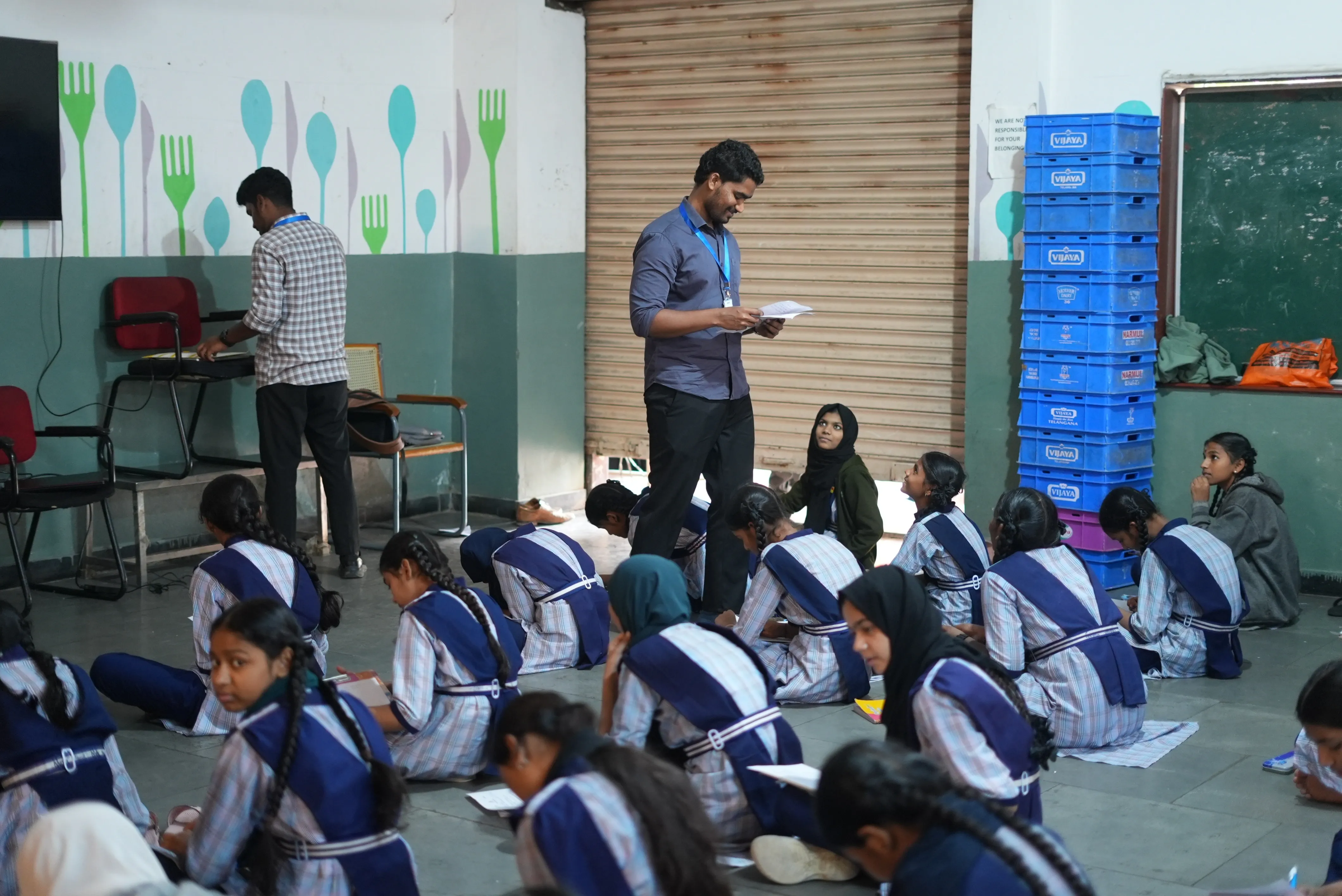 Rocky walking among students during the assessment session